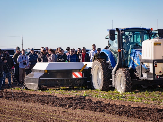 attendees of the Desert Difference AgTech Conference watch a field demo on Day 1 