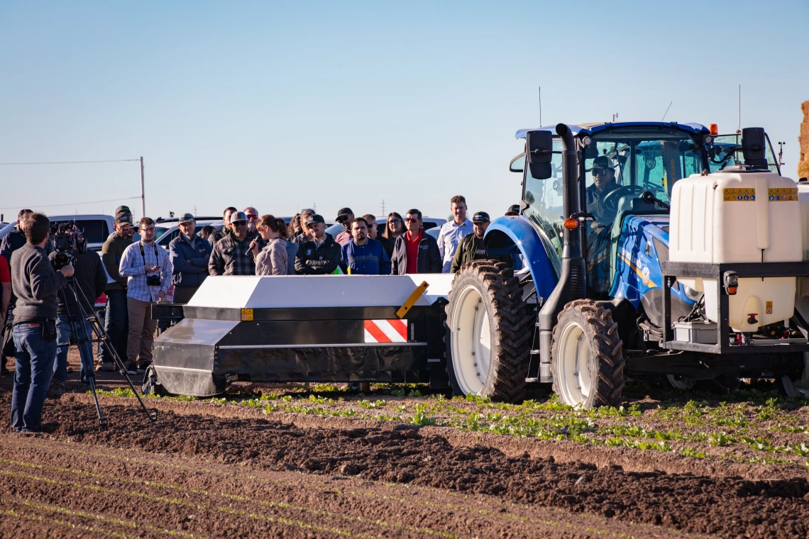 attendees of the Desert Difference AgTech Conference watch a field demo on Day 1 